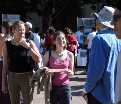 colin talking with smiling women at earthfair